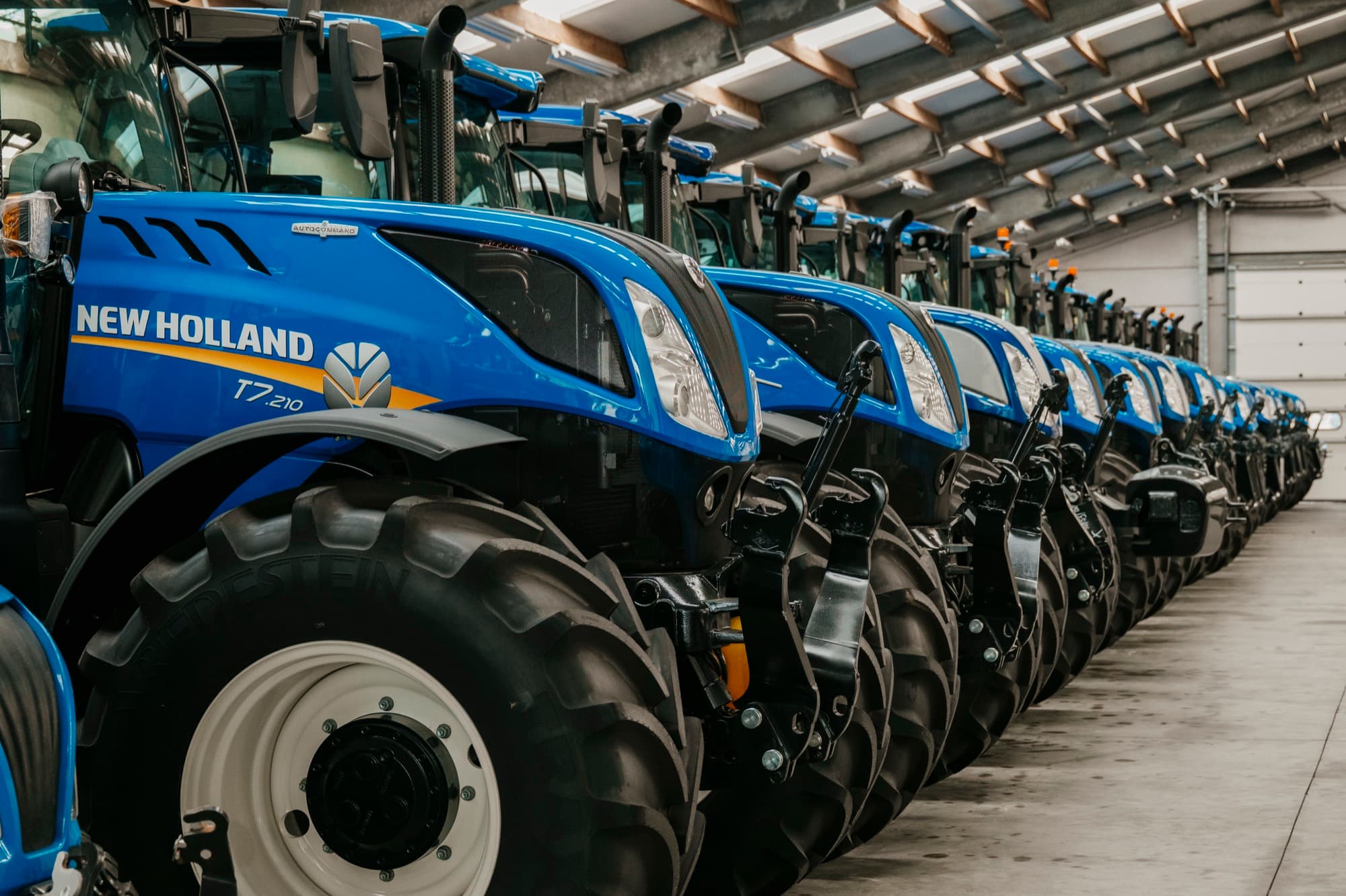 Row of New Holland tractors in the showroom