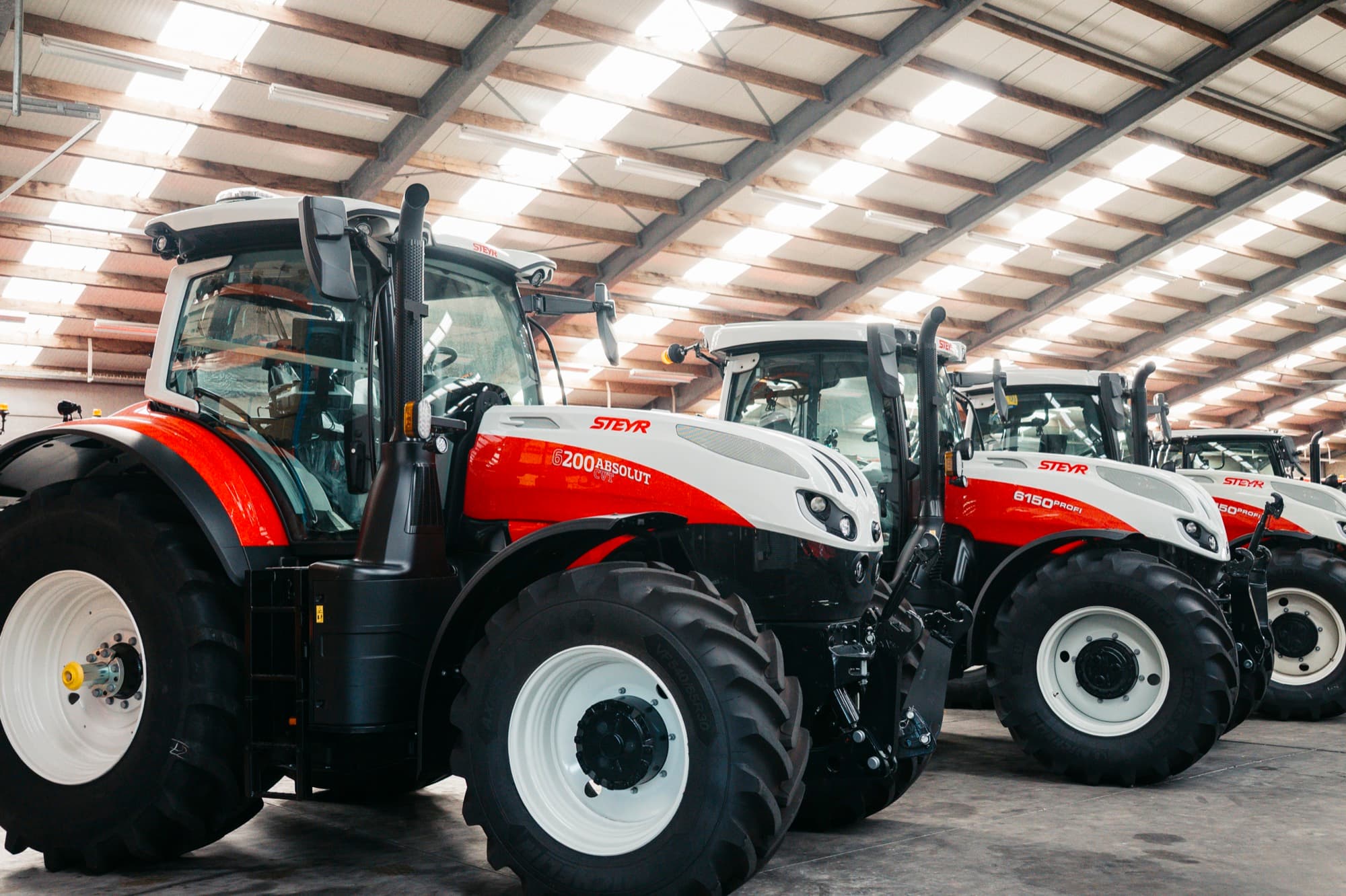 Steyr tractors lined up in the showroom