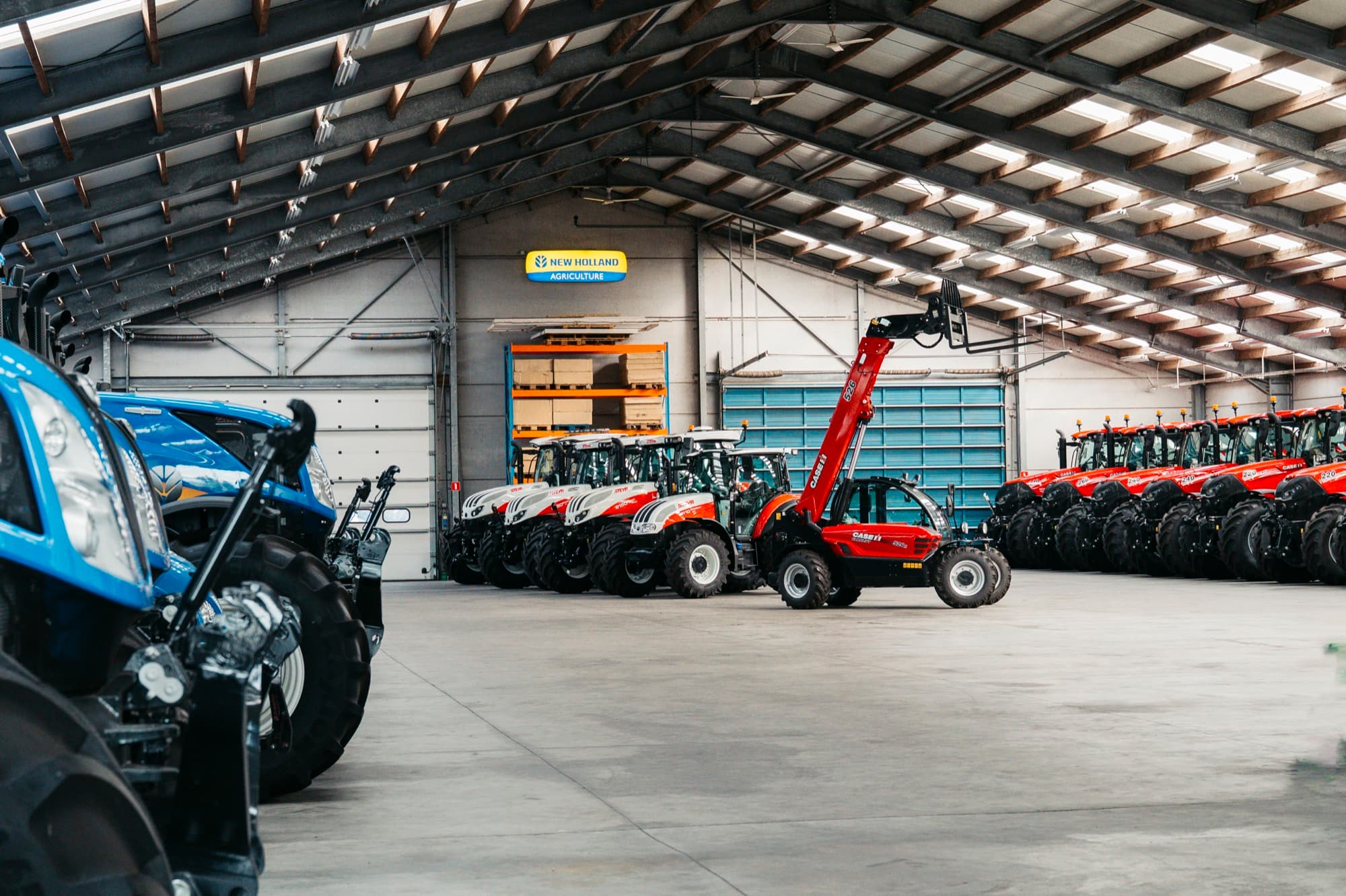 Westtrac showroom with New Holland, Steyr, and Case IH tractors